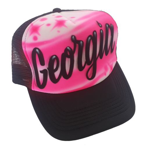 Black trucker cap with 'Georgia' text airbrush with a pink design on a white background