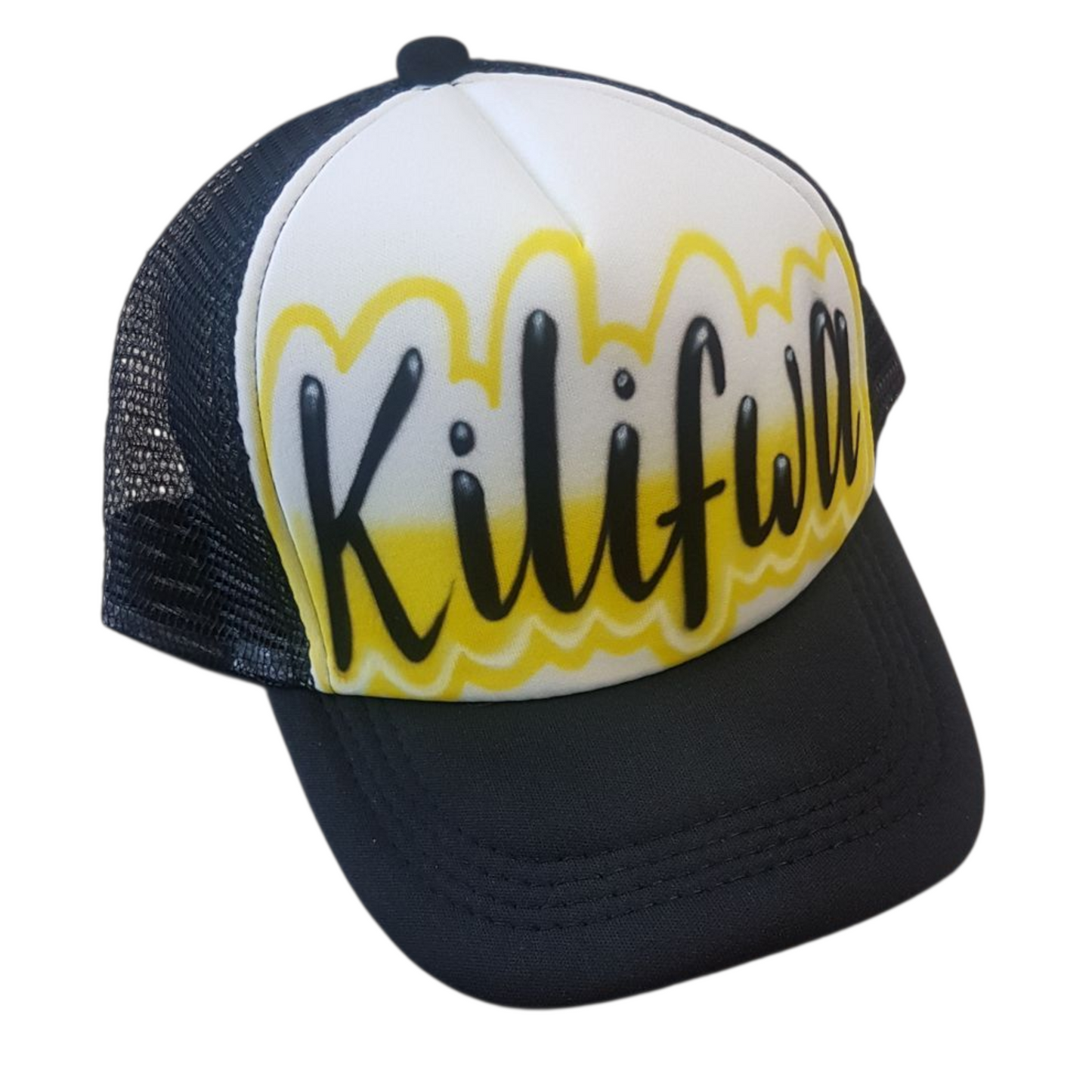 Black and white trucker hat with yellow airbrush design and black script text Kilifwa on a white background