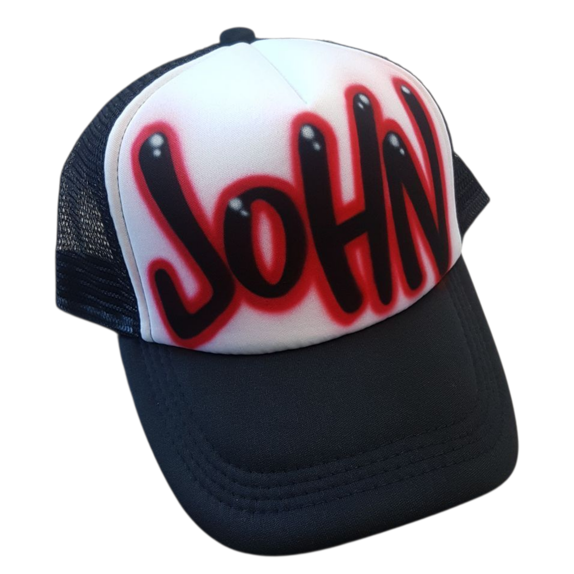 Black and white trucker cap with 'JOHN' in red and black airbrush graffiti text on a white background