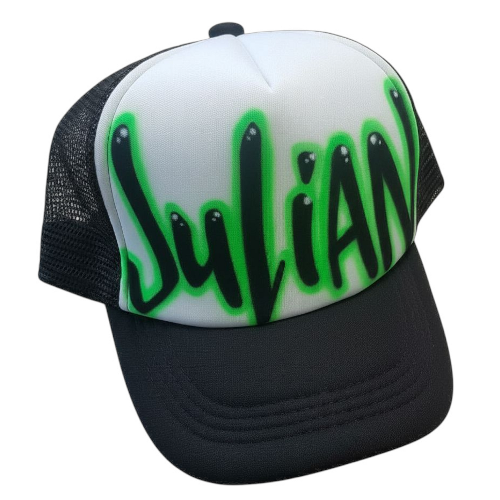 Black and white trucker cap with green and black airbrush text Julian on a white background