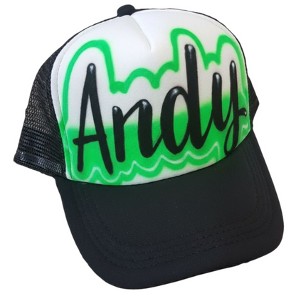 Black trucker cap with name Andy airbrushed in script font with a green design and black text on a white background