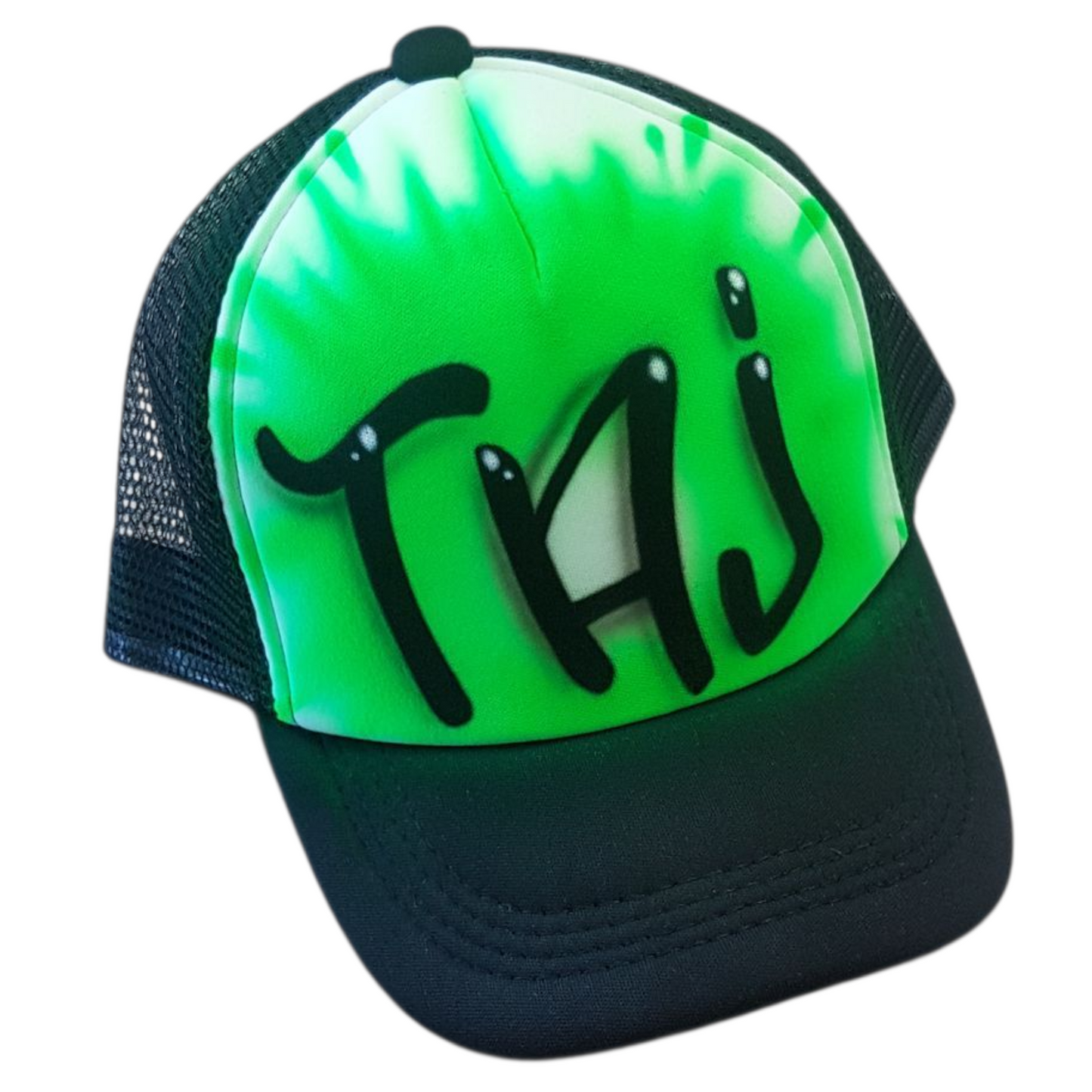 Black trucker cap with 'Taj' airbrushed with a green design on a white background