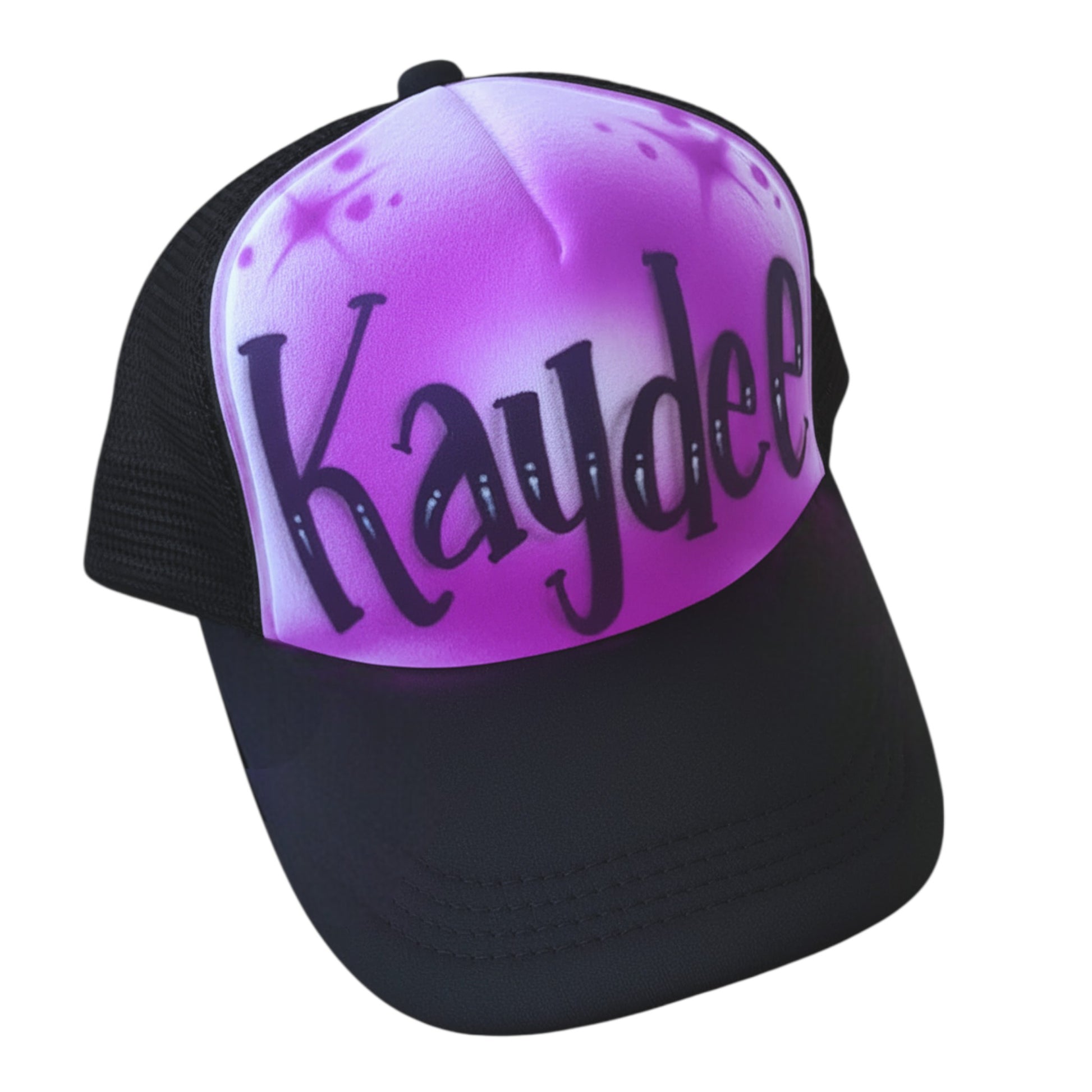 Black trucker cap with 'Kaydee' airbrushed on a purple gradient background